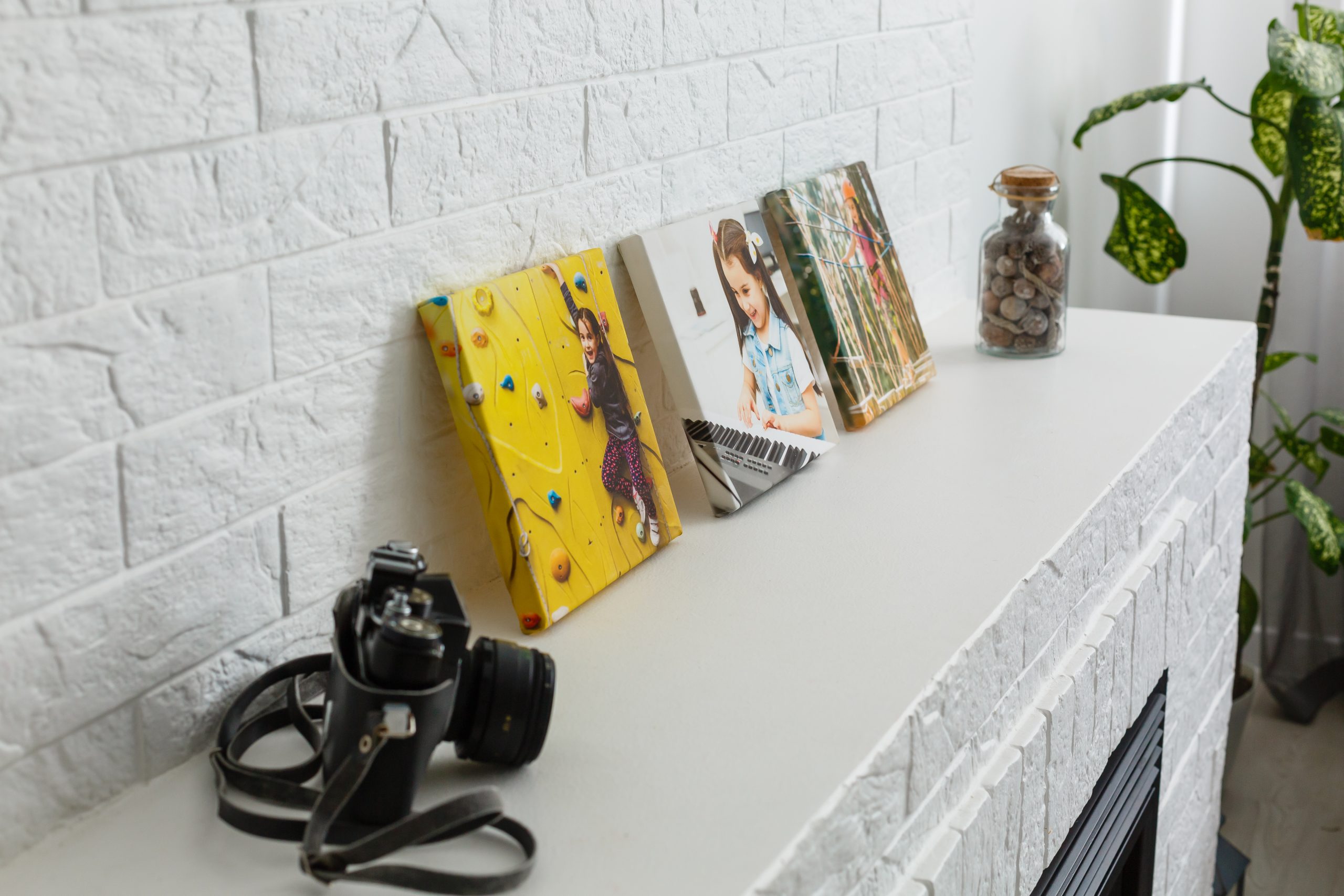 photo canvas on white brick wall collage in the interior